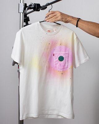 spray dyed tshirt hanging on hanger