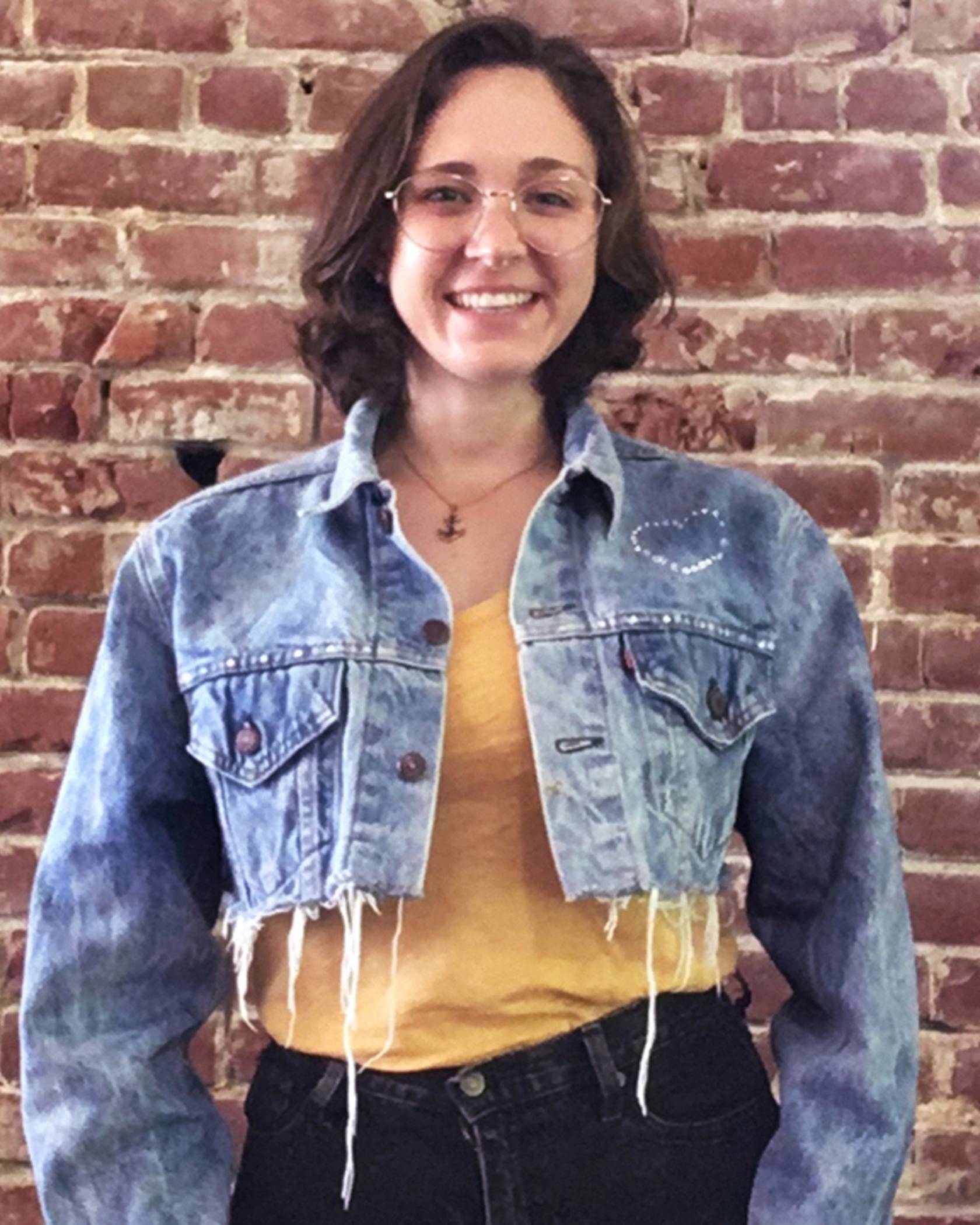 crystal denim jacket on woman smiling