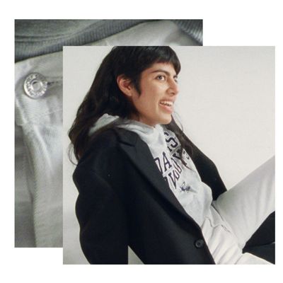 A profile photo of Maria Osado wearing a gray hoodie under a black tailored jacket.