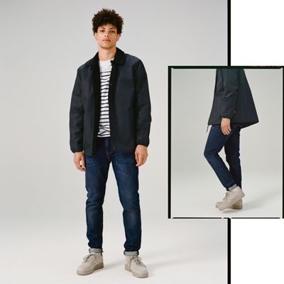 Man modeling the 512 slim taper jeans.