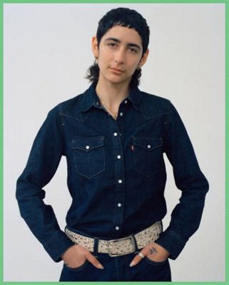 Someone wearing a button up shirt and jeans