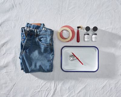 jeans with paint brush