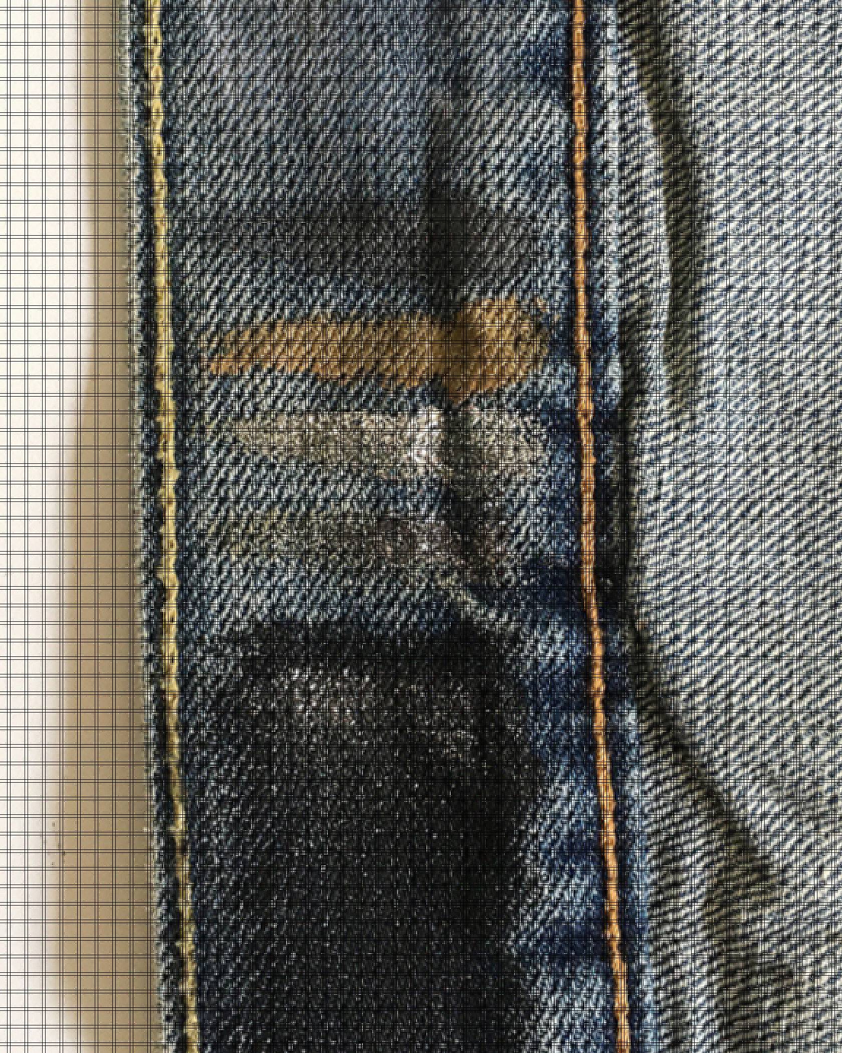 Image of grey, gold, silver, and black paint tested on the inside lining of a trucker jacket.