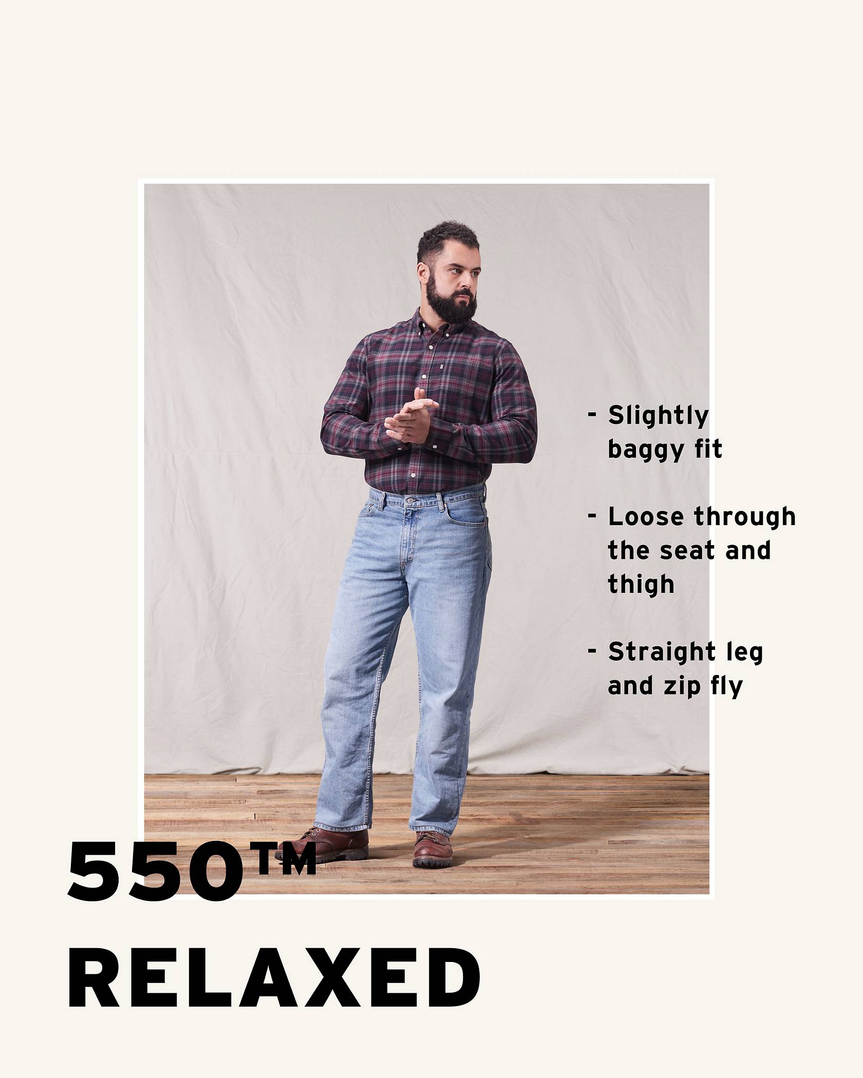 Model wearing a burgundy plaid shirt, 550™ Relaxed light wash jeans, and brown shoes while looking towards the left side of the camera.