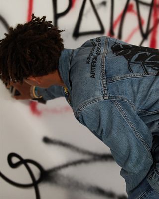 Jaden Smith writing on a wall.