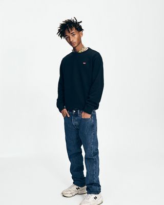 Jaden Smith wearing a black shirt and dark jeans.