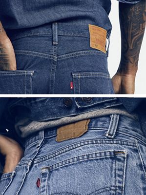 Butts of 2 different pairs of levi's, dark and light wash