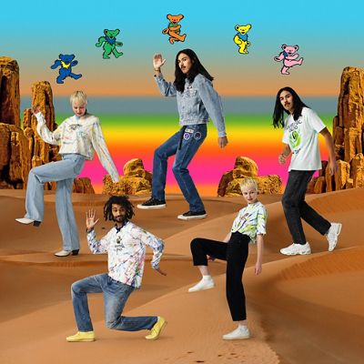 Models in the desert with a rainbow sky wearing pieces from the grateful dead collaboration
