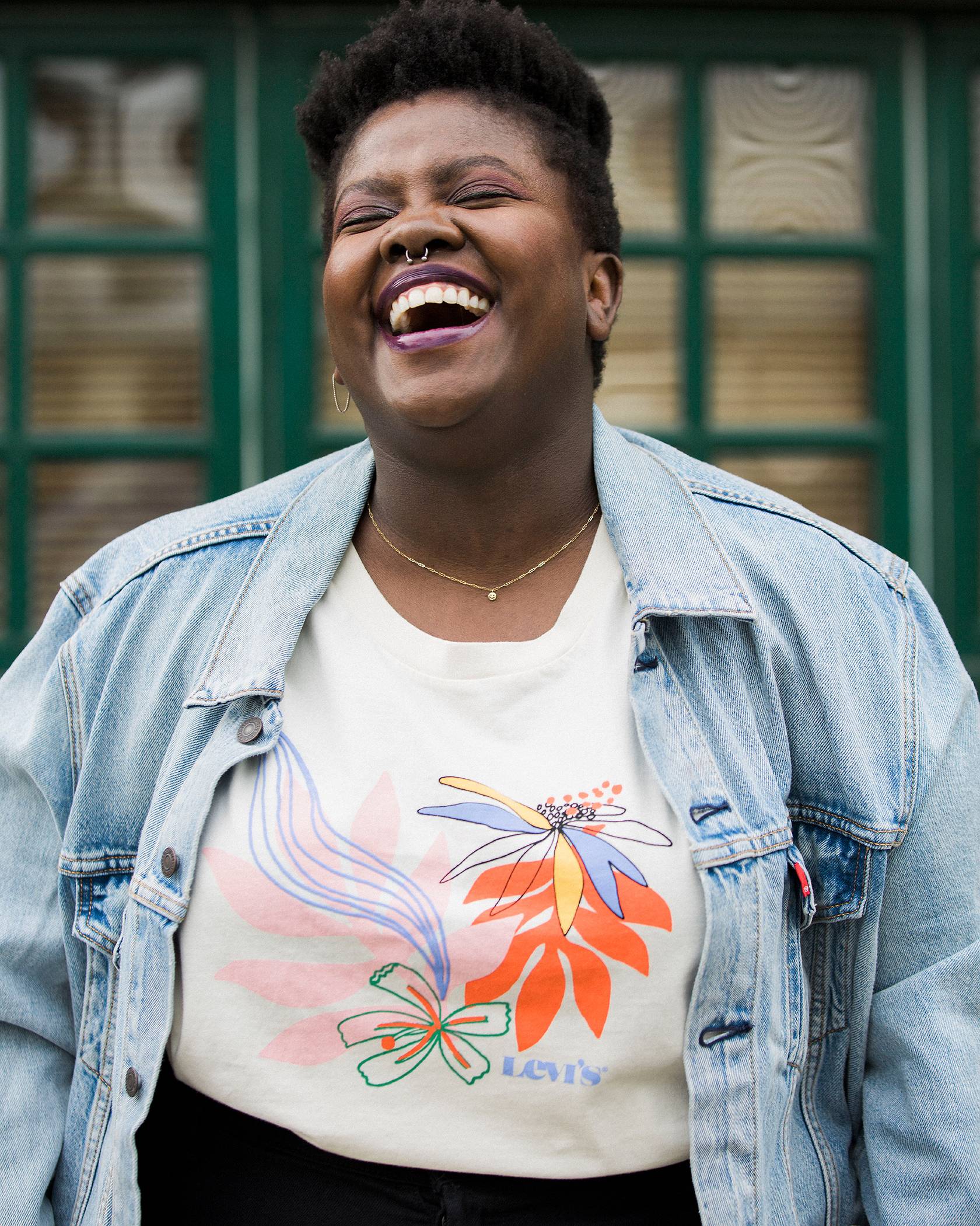 Portrait of Lydia Okello laughing.