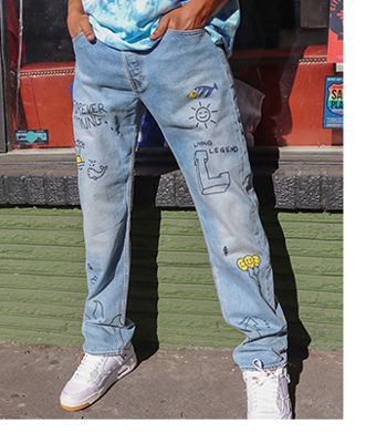 A photo from the waist down of Skip Jones wearing jeans