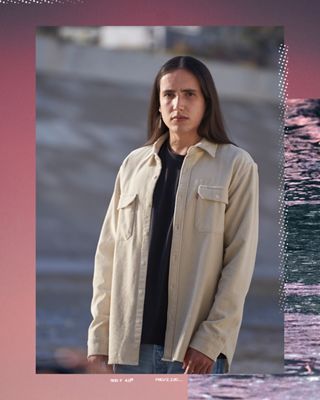 A portrait shot of Xiuhtezcatl wearing a tan Levi's button up