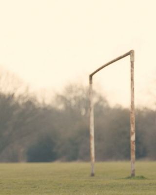 A photo of a soccer goal with no net