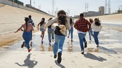 Xiuhtezcatl and kids running down a spillway