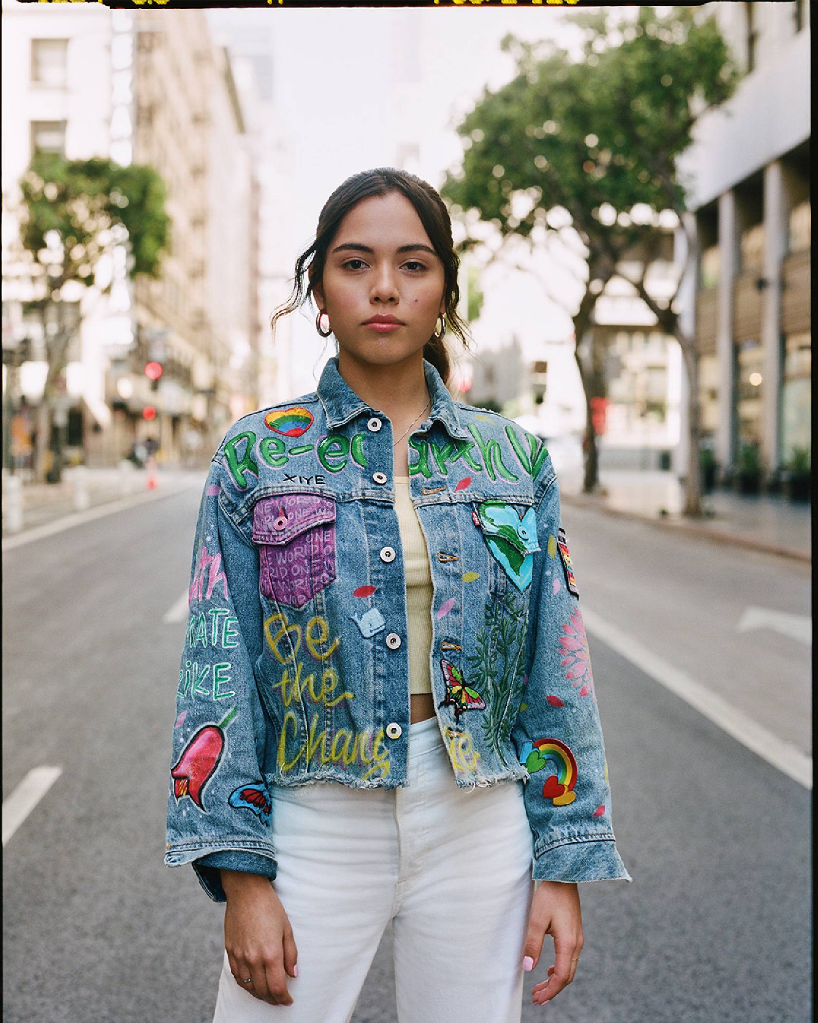 Xiye standing in the street in her custom Levi's trucker jacket