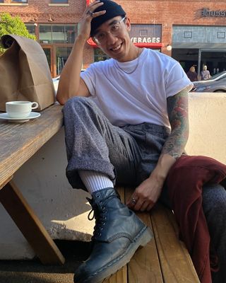 Men's holiday style sitting in chair