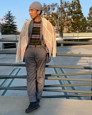 Men's holiday style standing outside