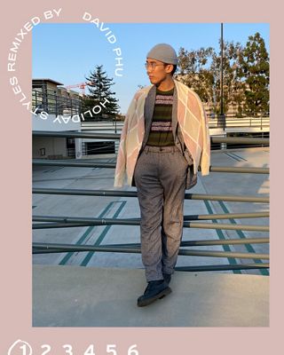 Man in sweater standing outside.