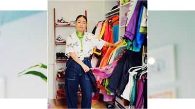 Jezz Chung in her closet looking through clothing, styled in high wasted Levis denim jeans in dark blue