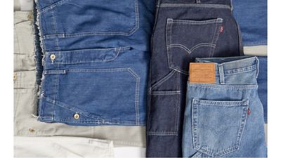 Flat lay image of jeans on the floor.