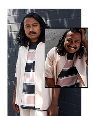 model in bold striped polo shirt