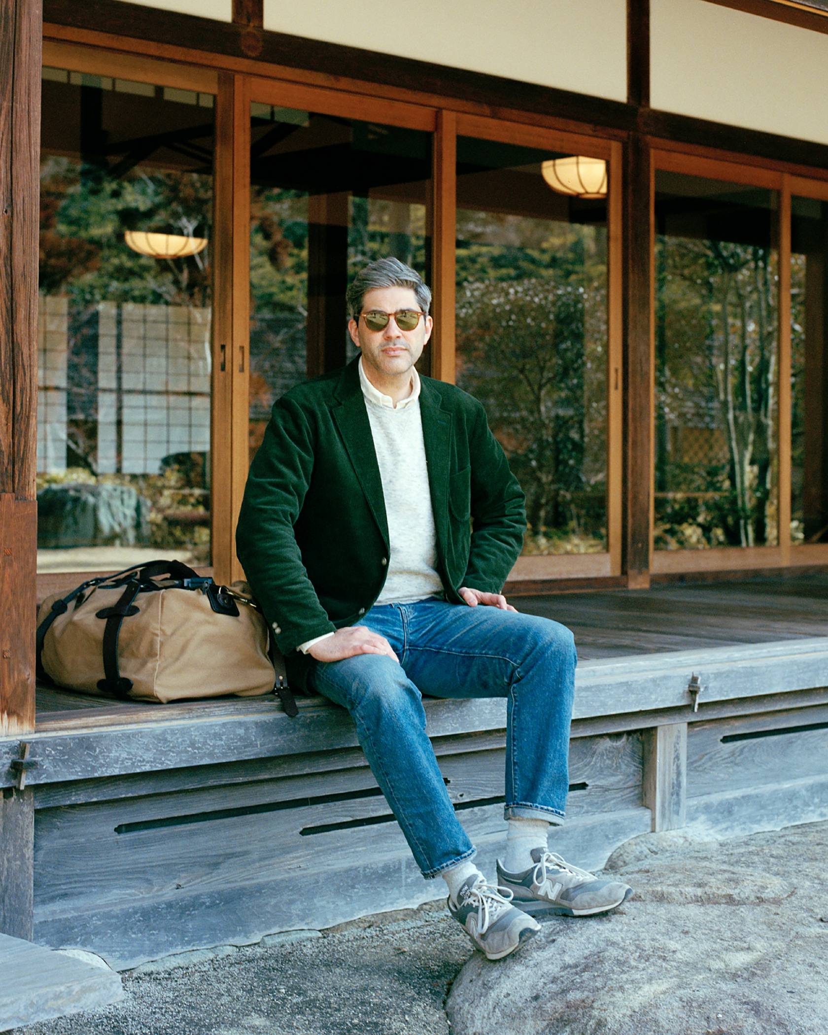 Levi’s® Made & Crafted® showing Tokyo-based writer W. David Marx sitting on wooden bench outside Japanese style building