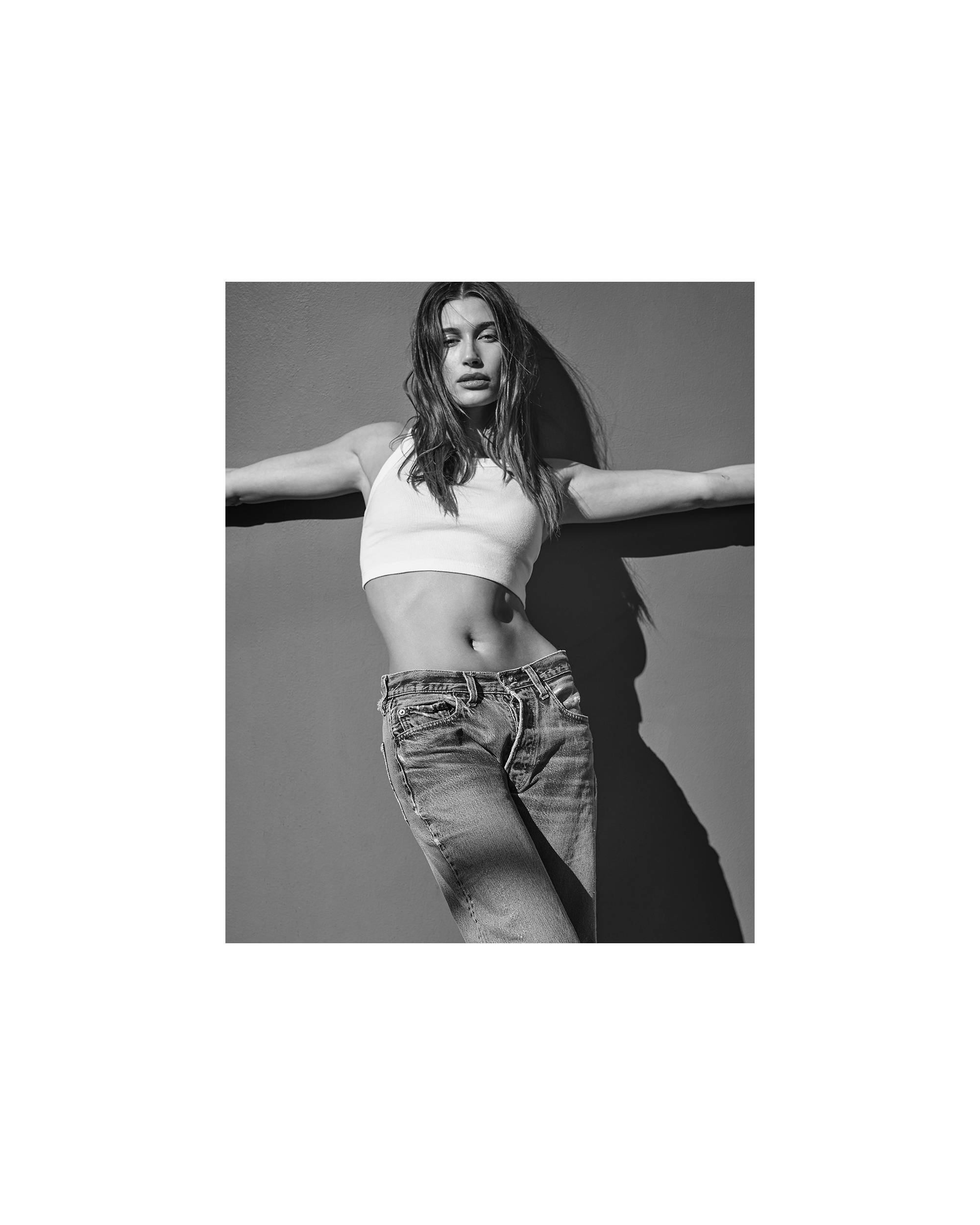 Levis 501® Jeans styled on Hailey Bieber, in white sleeveless crop top. Front view.