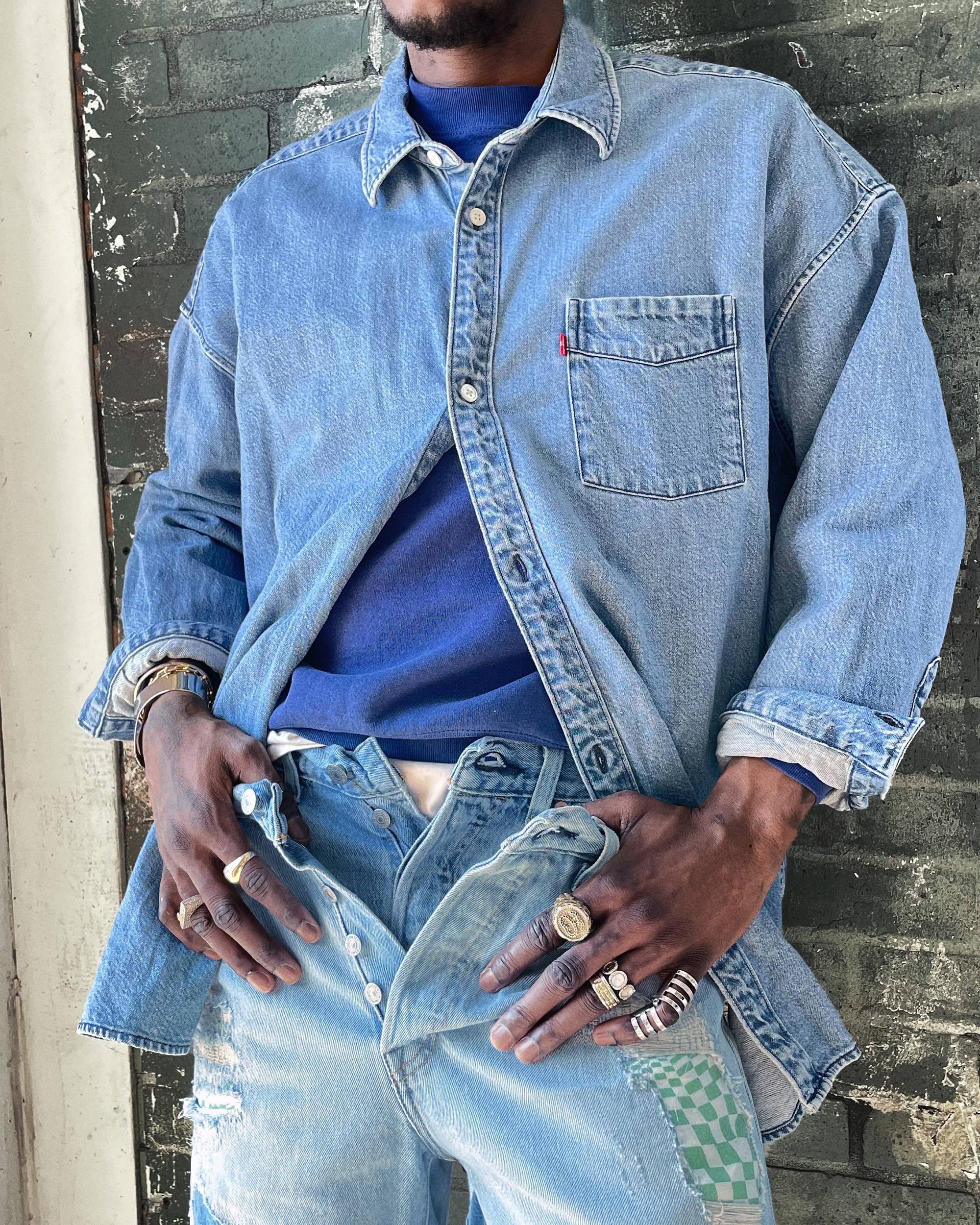 Close up of man wearing layered denim pieces for a styled look