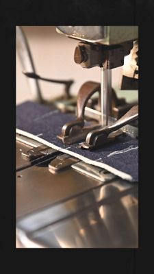 Videos of a Lead Tailor from New York working on a pair of bespoke Levi's® denim jeans with images of buttons, raw denim fabric, and zippers.