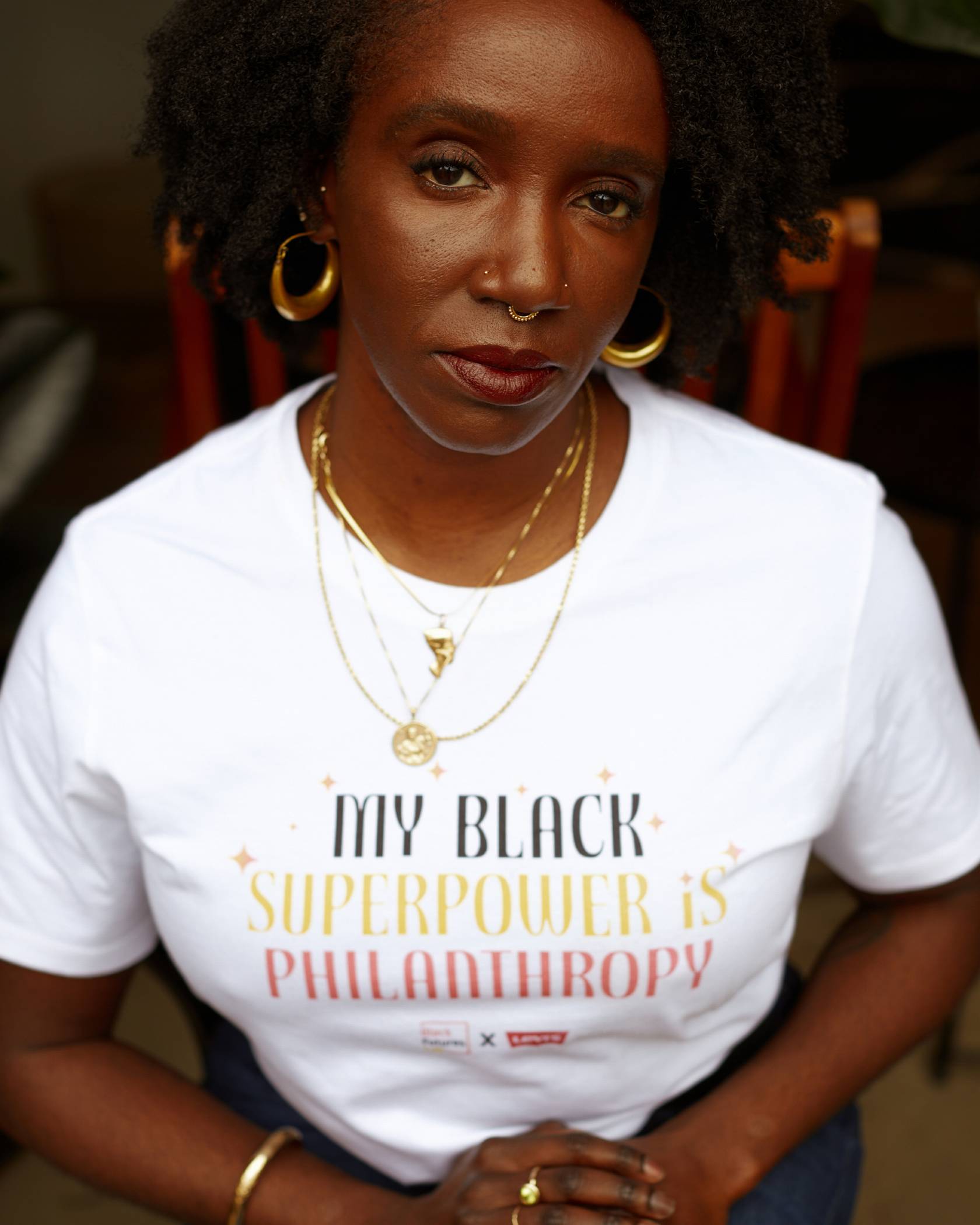 Nwamaka Agbo wearing black superpower shirt.