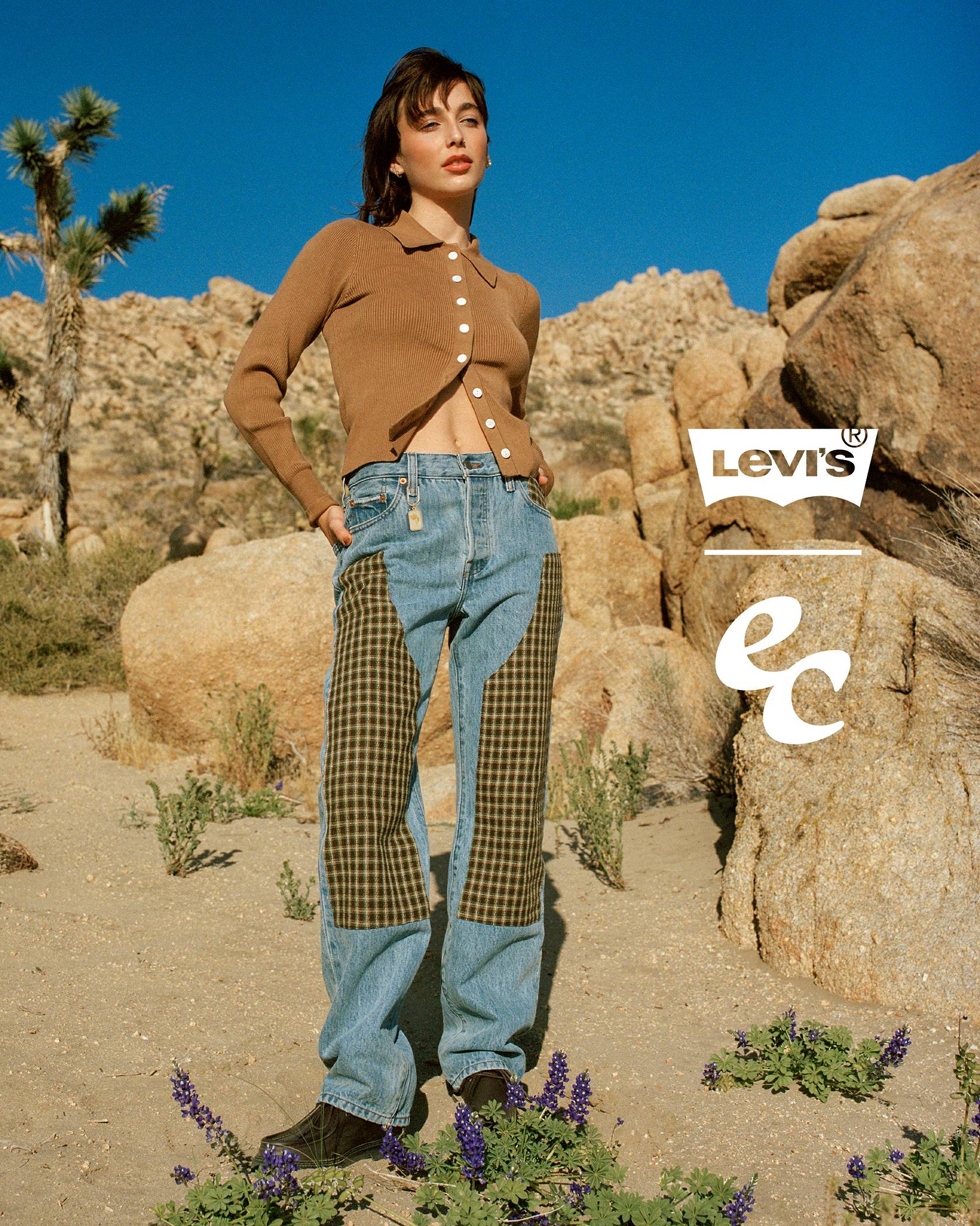 Photo of Emma Chamberlain posing in Levi's® x Emma Chamberlain clothing against a desert backdrop