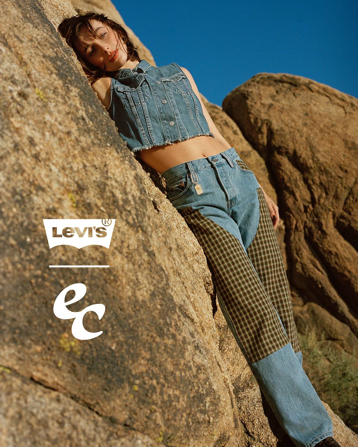 Emma Chamberlain wearing a pair of mid-wash, patched Levi's® 501®'s for her collection with Levi's®.