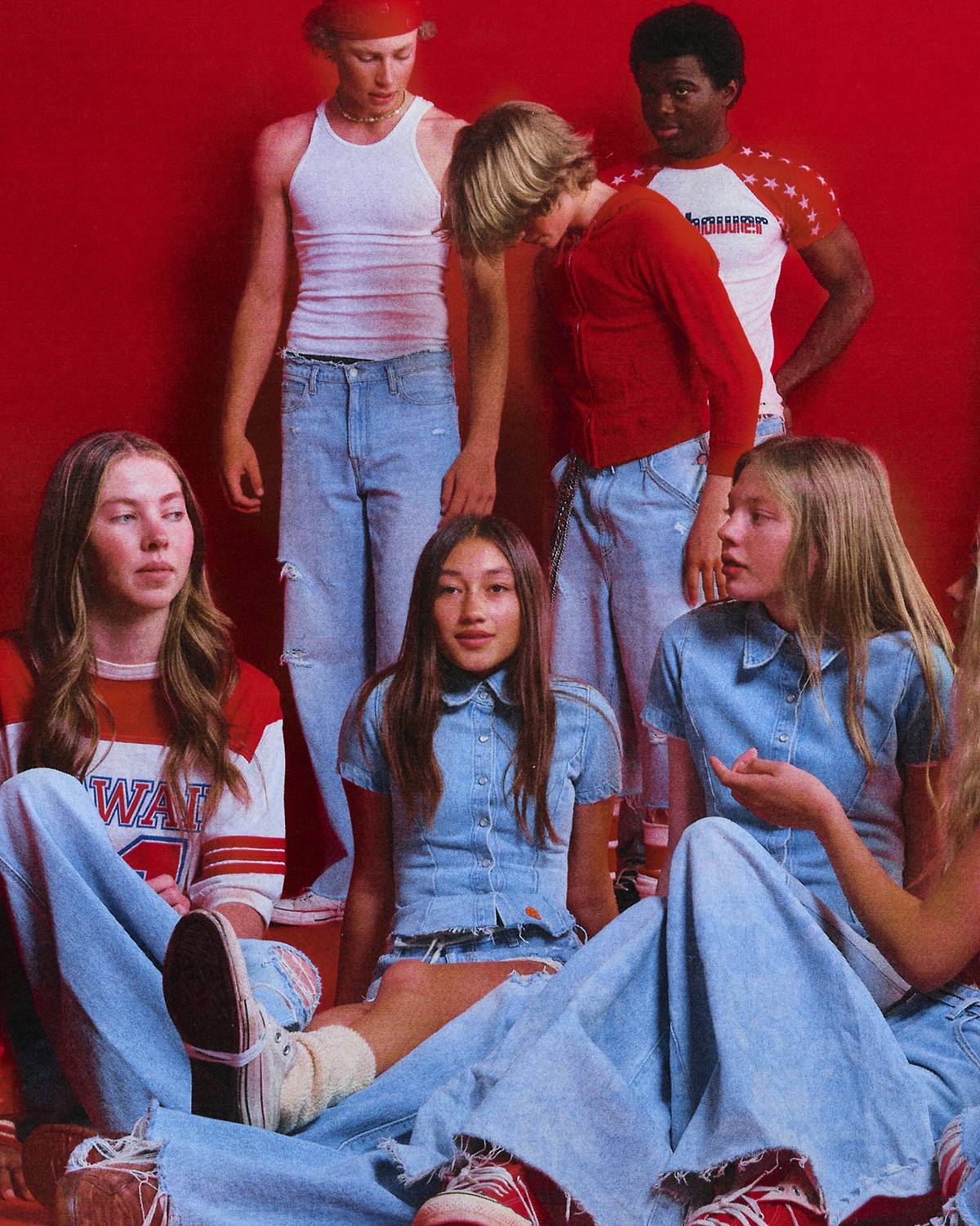 Image with vintage effect of models in light wash denim that is a part of the Levi's® x ERL collaboration.