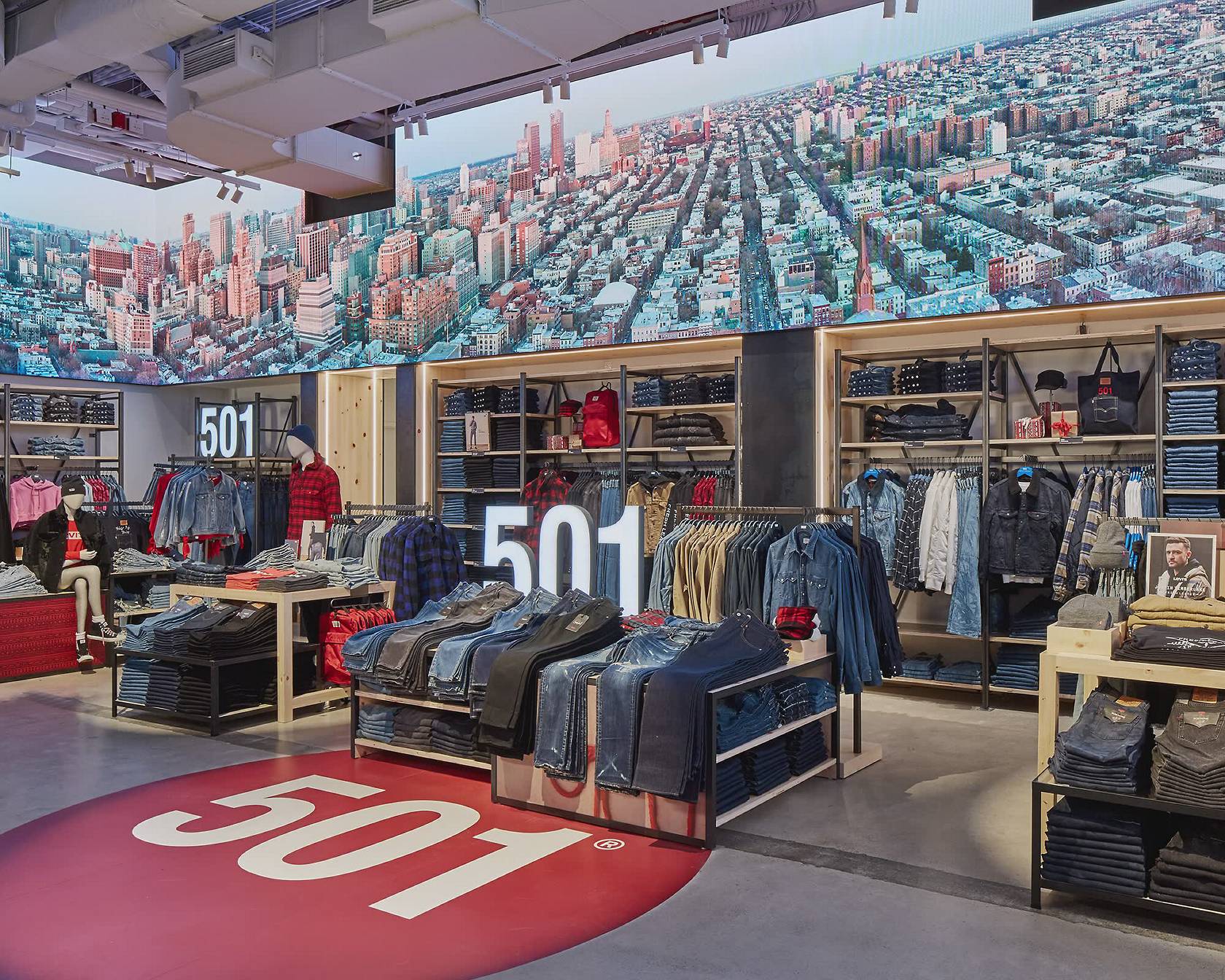 Animation of a trucker jacket, the inside of a Levi's® store, a tailor holding thread, a woman in Levi's® smiling, a man and a woman wearing Levi's® and hugging, a person wearing jeans with their back pocket filled with bandanas.