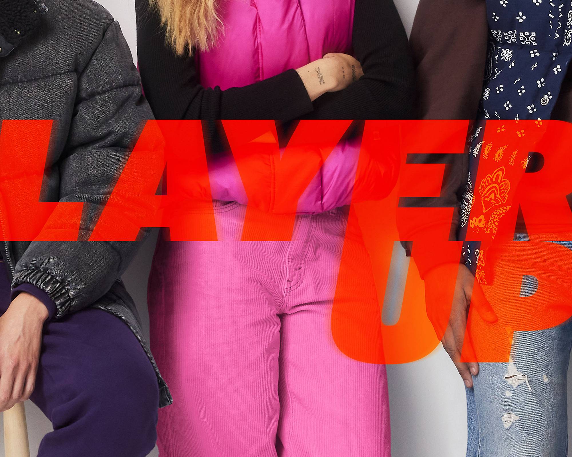 Zoomed in shot of models in multi color layered outerwear looks with overlaid saturated and glowing bold orange type treatment "LAYER UP" 