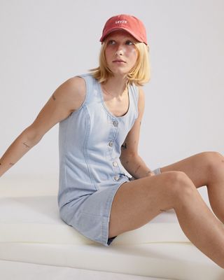 Model in light wash denim dress