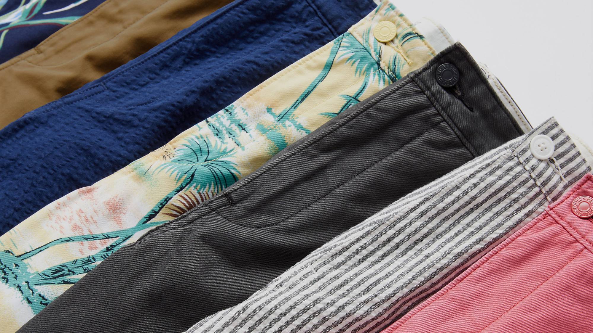Flat lay of multi color & pattern XX Chino Shorts