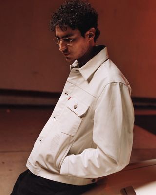 Image of model in Stussy x Levi's collab.