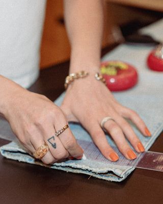 Amy hemming a pair of pants