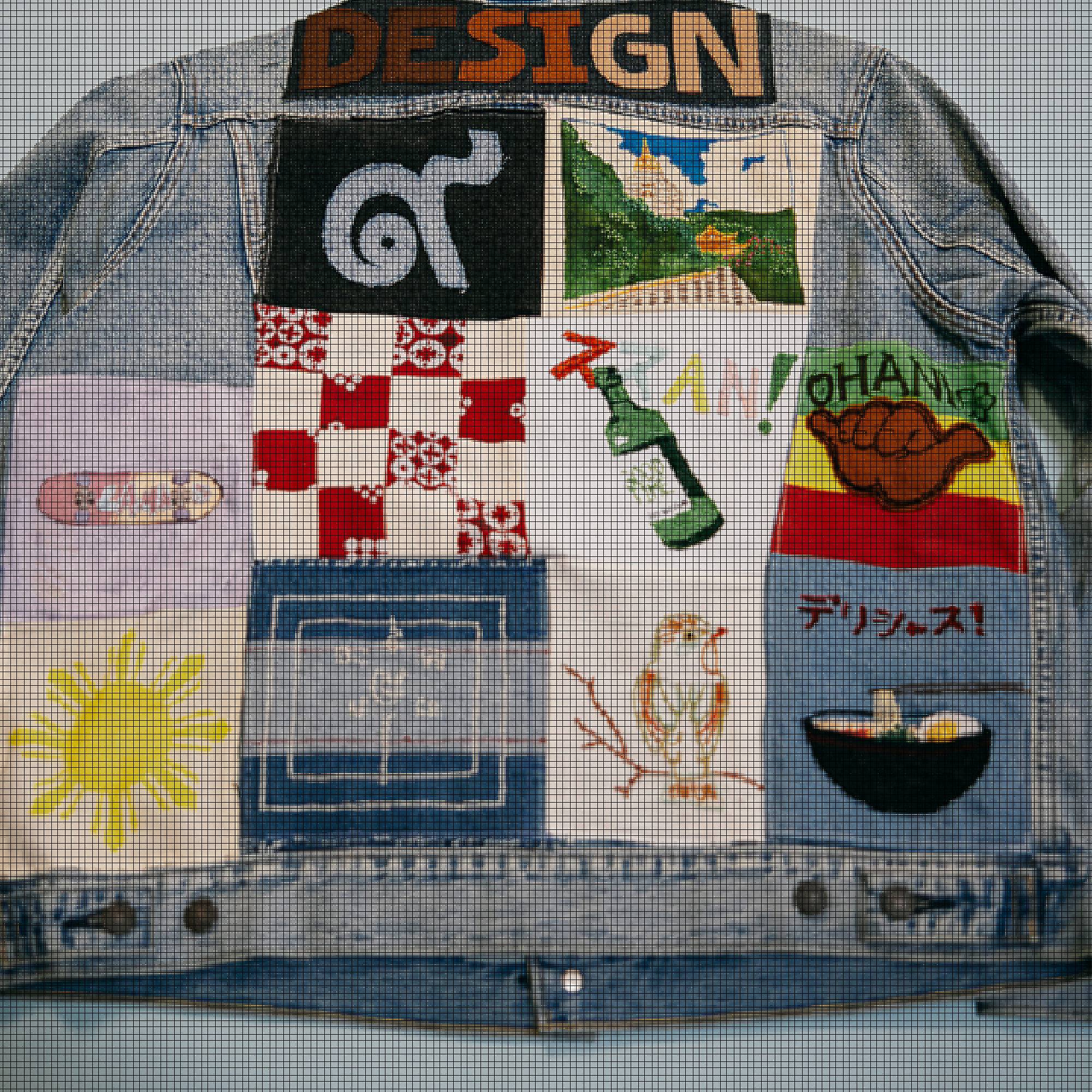 the back of a trucker jacket with a quilted design of different colored and patterned squares
