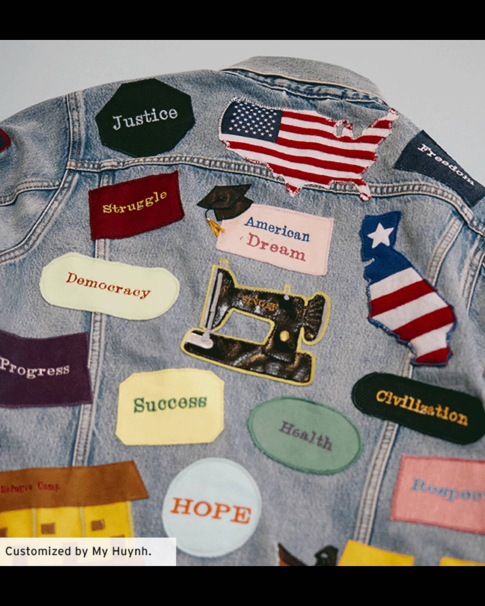 A customized trucker jacket with different patches all over it