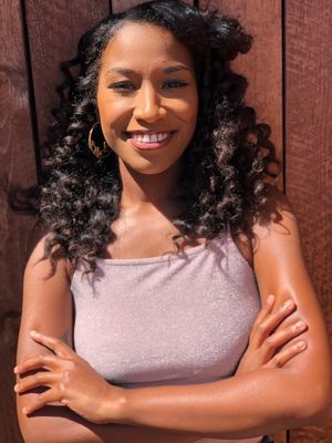 Portrait of Asia Medley smiling.