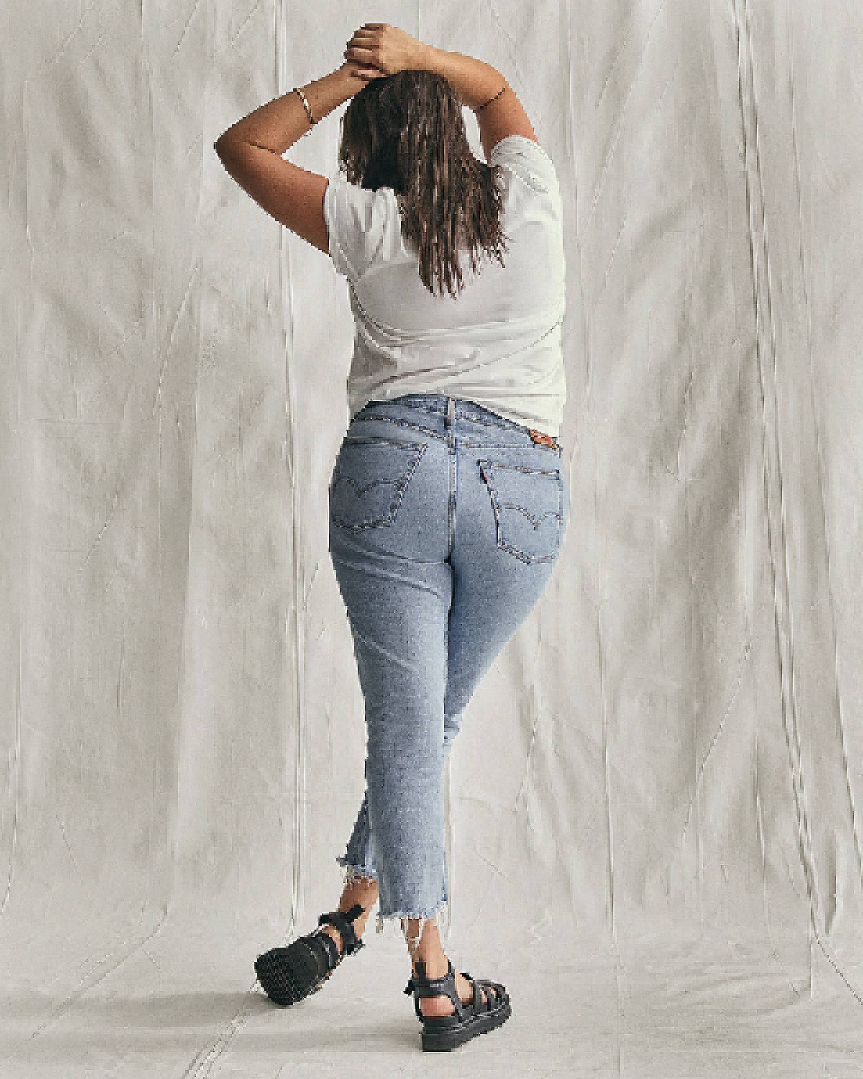 Model wearing a pair of Levi's® Wedgie Jeans.