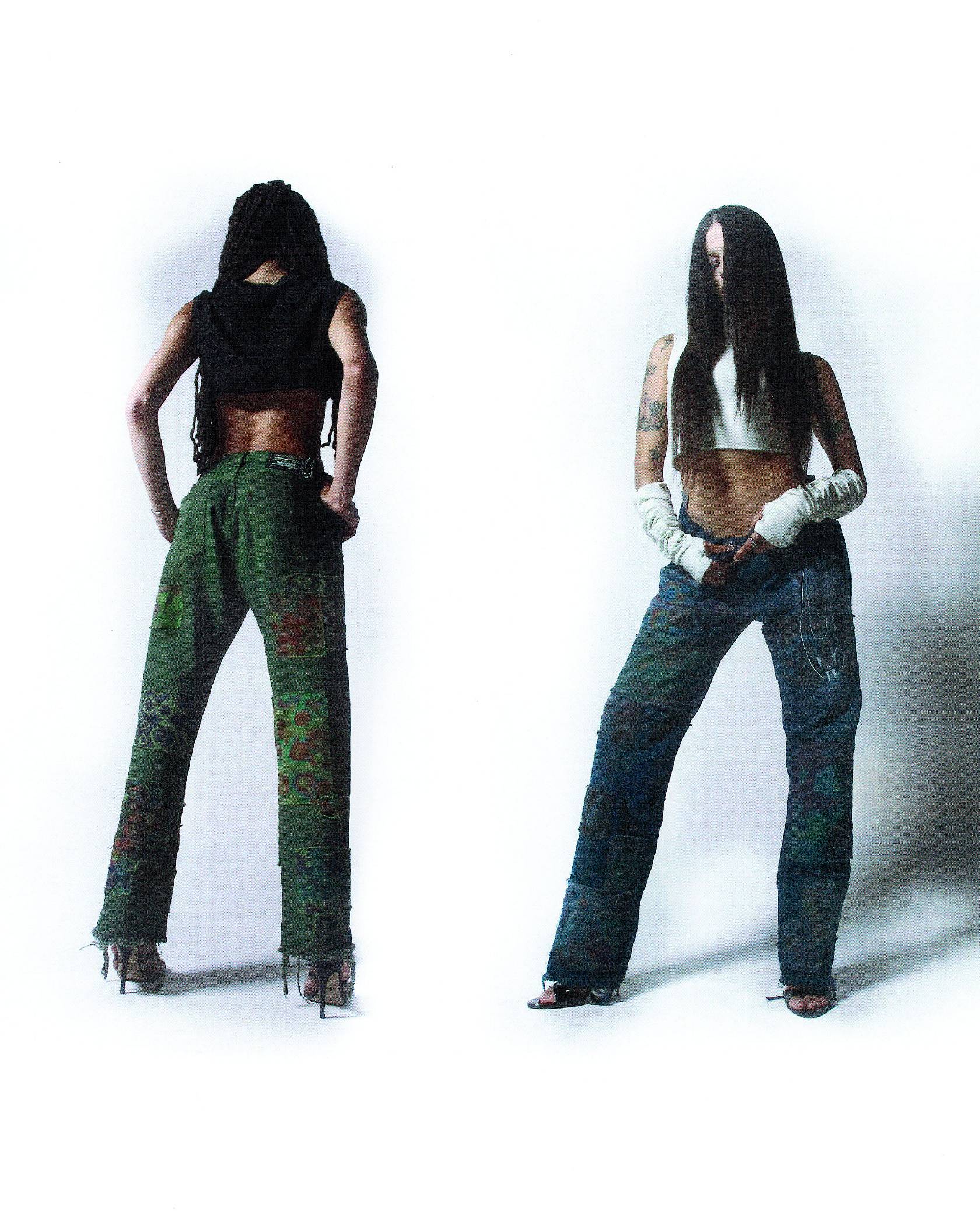 2 models - one facing forward in the blue colored jeans, the other with their back turned wearing the green
