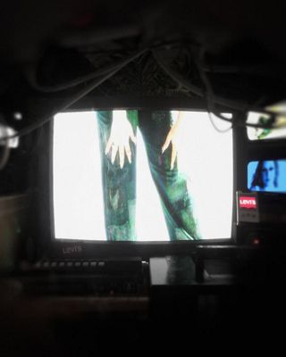 Glitchy 00s tech video of Barbie Ferreira and other models in her patchwork jeans