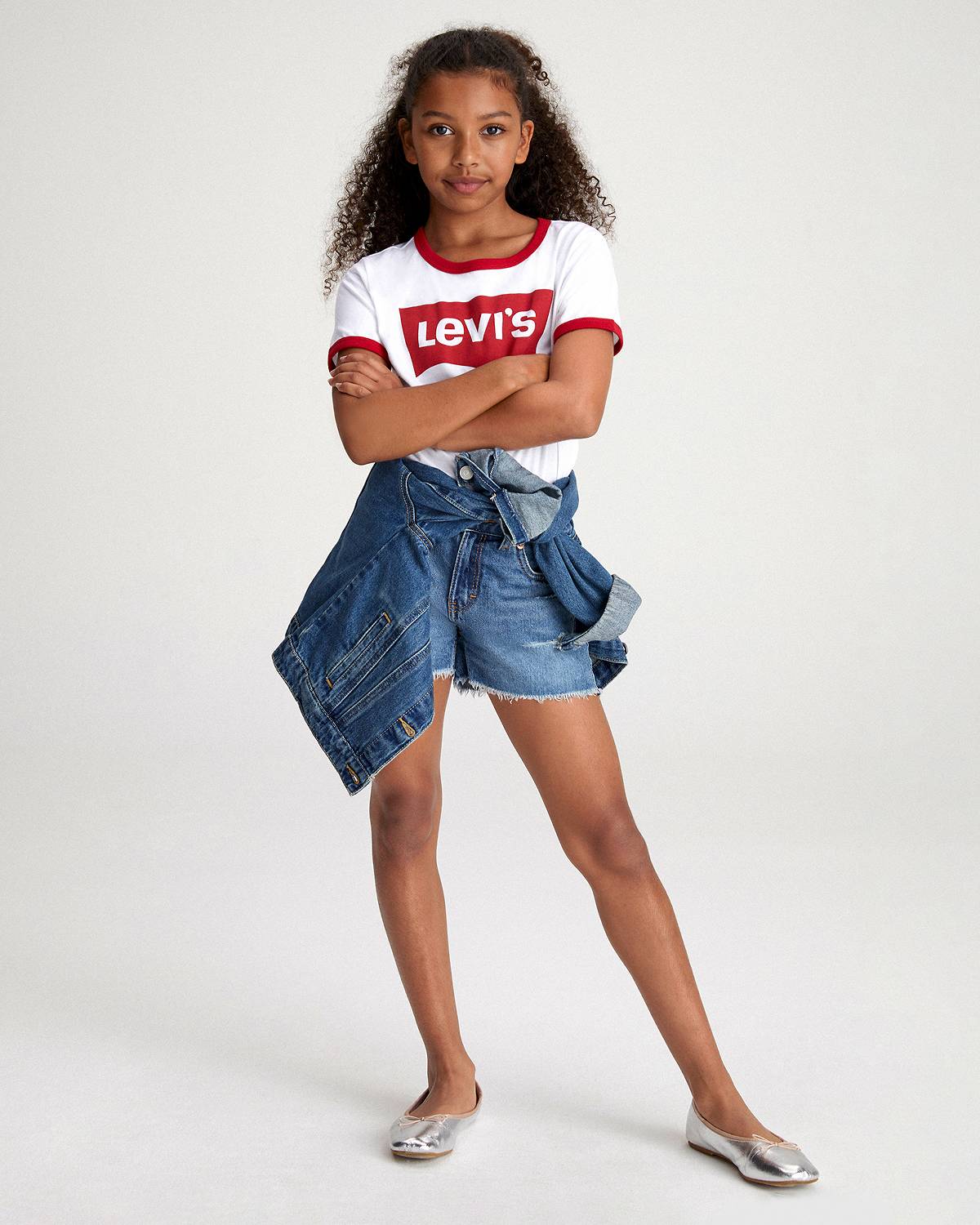 Big girl model wearing shorts and a tee.