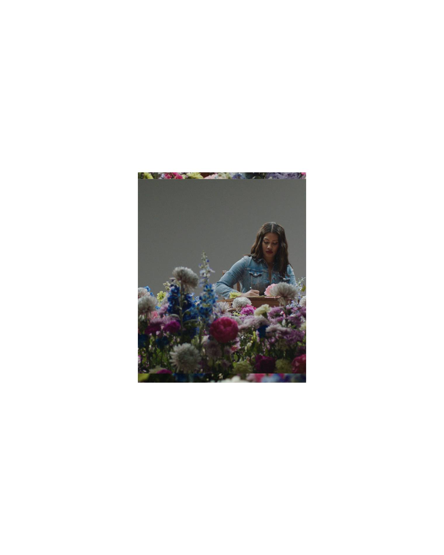 Leyna bloom sitting in flowers