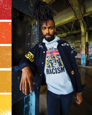 SENAY ALKEBU-LAN leaning against a wall.