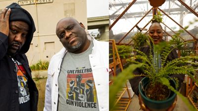 2 men and a women holding a plant