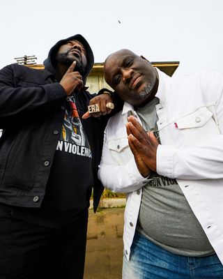 Two men standing together