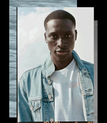 A portrait photo of a man wearing Levi's Wellthread jean jacket and a white tee